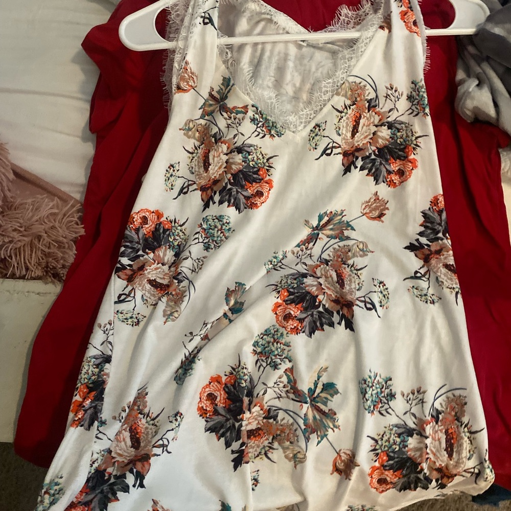 This cute tank top is a medium but runs equivalent to a large. Never worn.